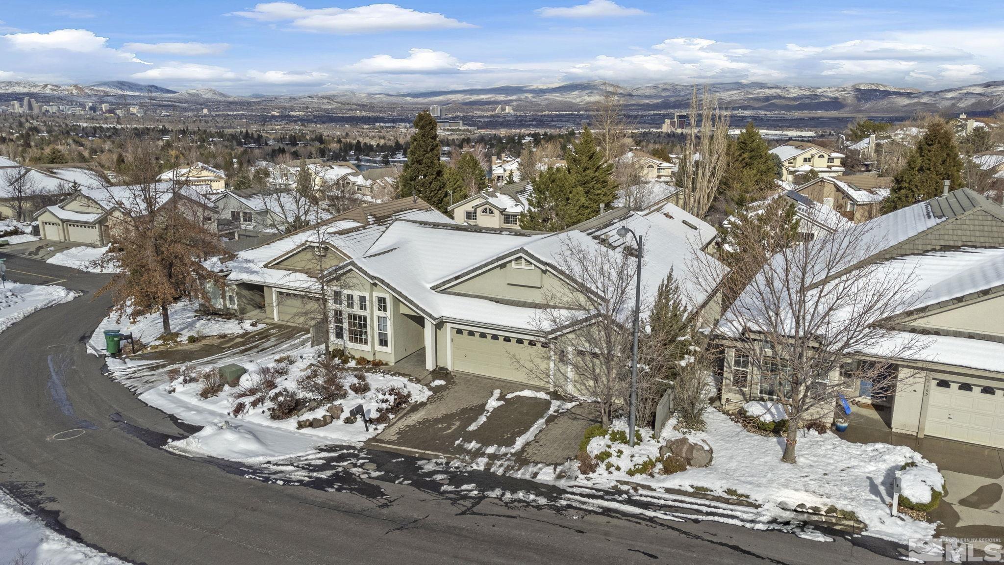 6075 Sunrise Meadows Loop Reno, NV 89519 - Photo 1 of 38 an aerial view of a house with a ocean view