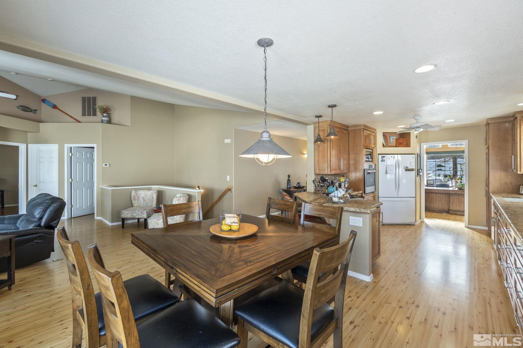 6075 Sunrise Meadows Loop Reno, NV 89519 - Photo 12 of 38 a view of a dining room with furniture