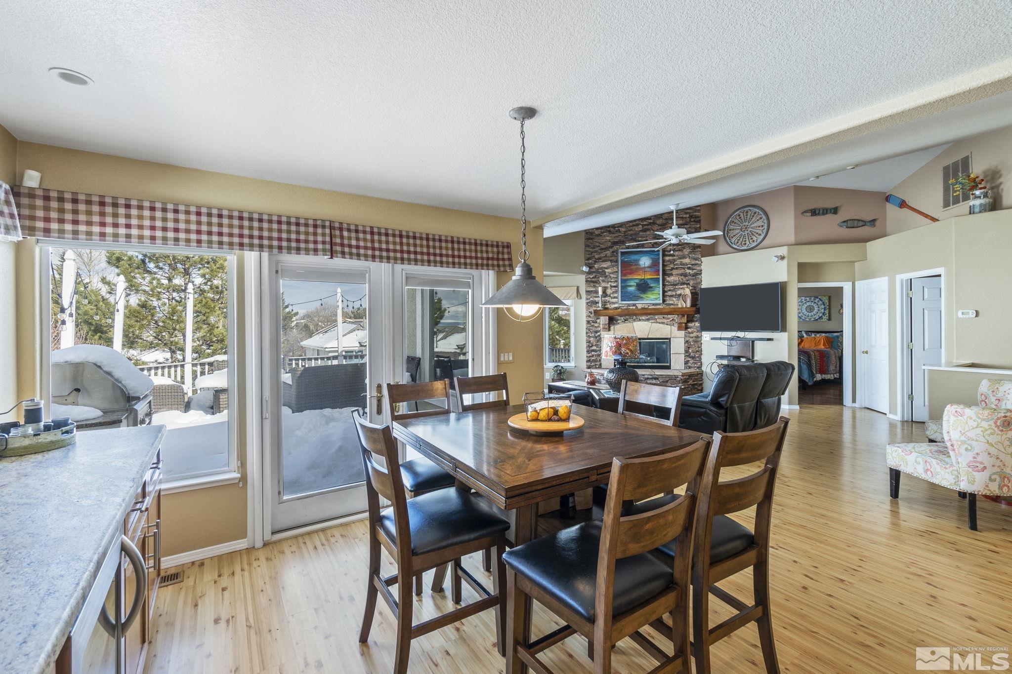 6075 Sunrise Meadows Loop Reno, NV 89519 - Photo 37 of 38 a dining room with furniture window and wooden floor