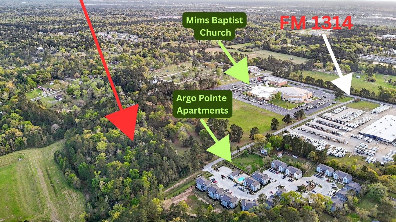 a street sign on a bunch of flowers