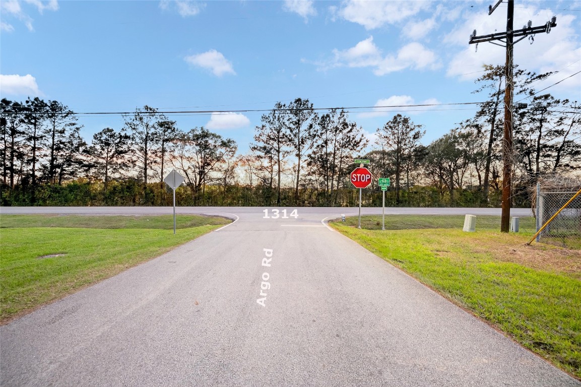 0 Argo Road Conroe, TX 77301 - Photo 10 of 11 a view of a swimming pool and trees in the background