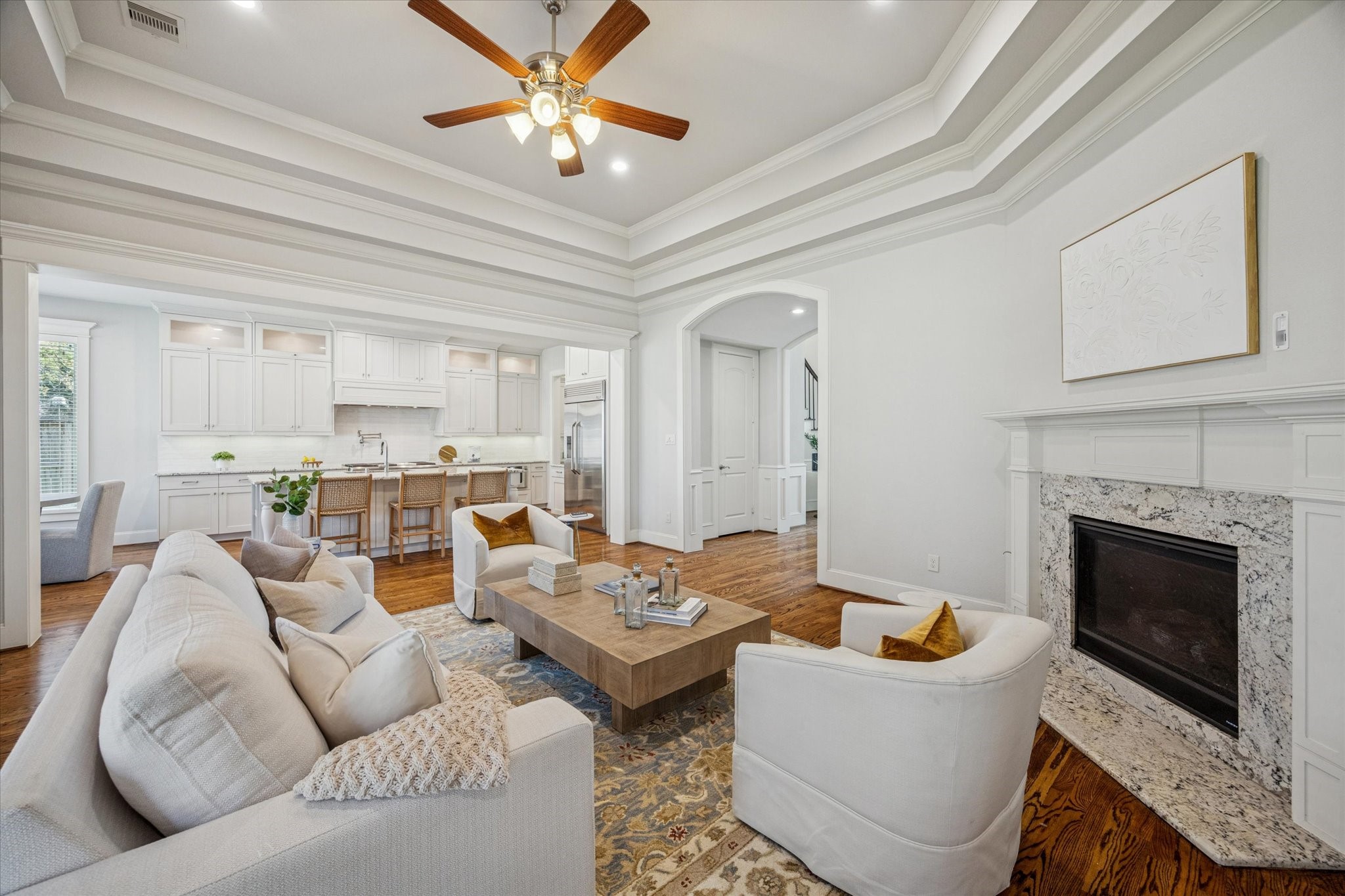 1802 Wakefield Drive Houston, TX 77018 - Photo 13 of 47 The living room is the center of the home with sight lines of the kitchen and breakfast nook. Neutral colors and classic hardwood floors provide a blank slate for any style.