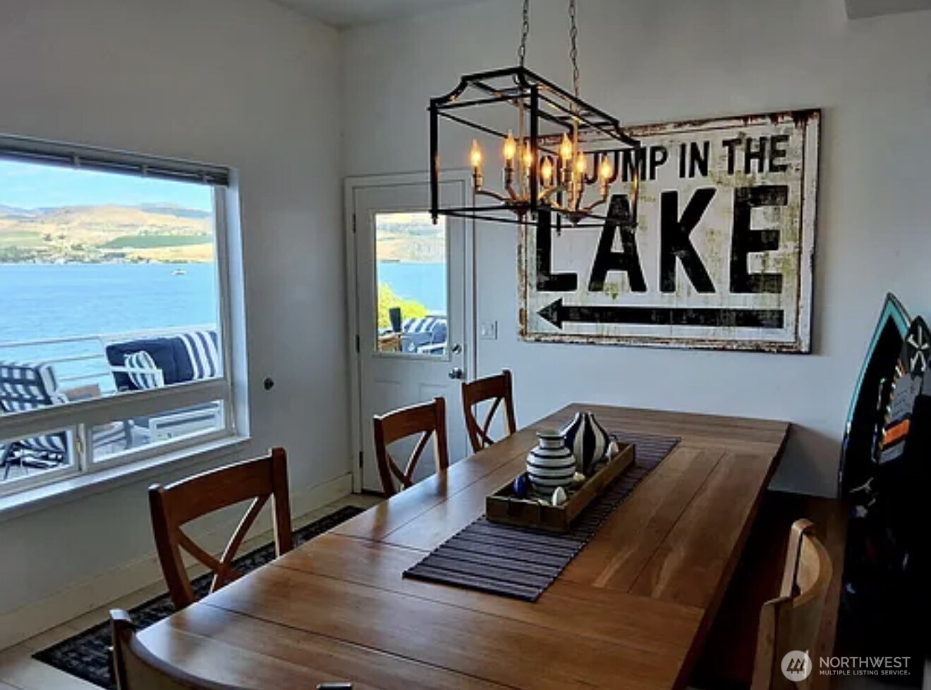 2685 South Lakeshore Road Chelan, WA 98816 - Photo 7 of 16 a view of a dining room with furniture window and wooden floor