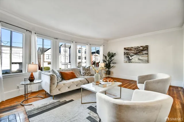 a living room with furniture and a rug