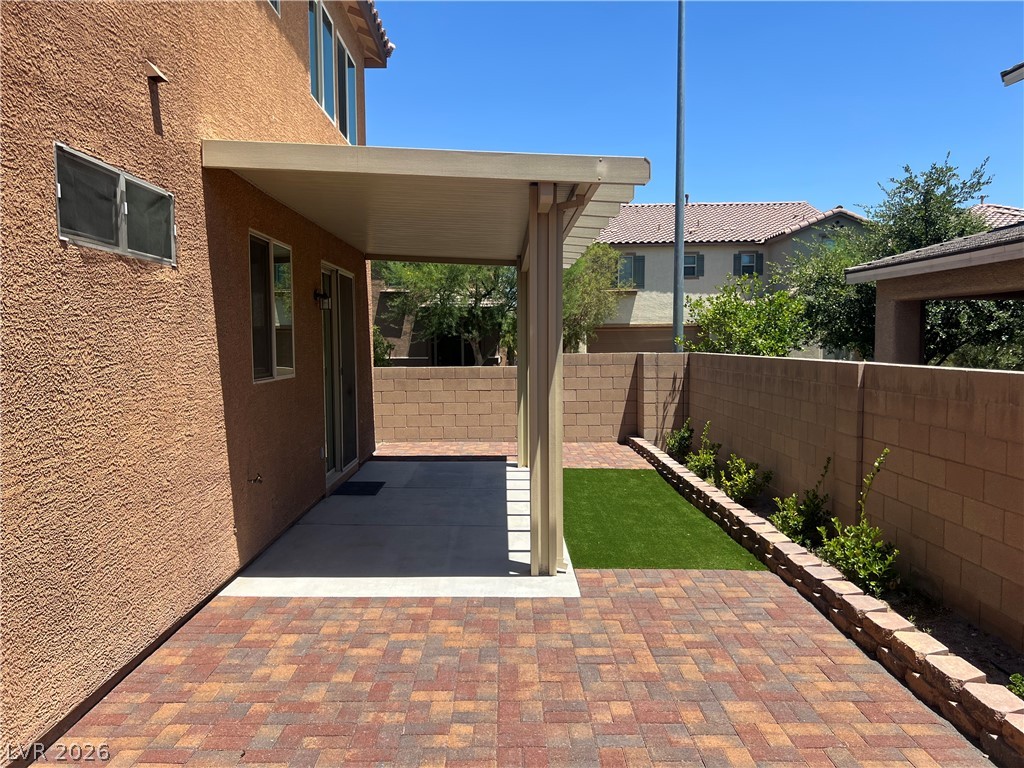 9581 Aberdeen Ridge Court Las Vegas, NV 89148 - Photo 3 of 25 A private outdoor space with a covered patio provides a perfect setting for relaxation.