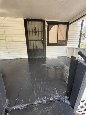 a view of an empty room and window