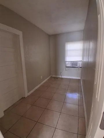 a view of an empty room and window