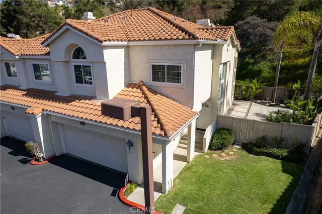 a aerial view of a house with a yard