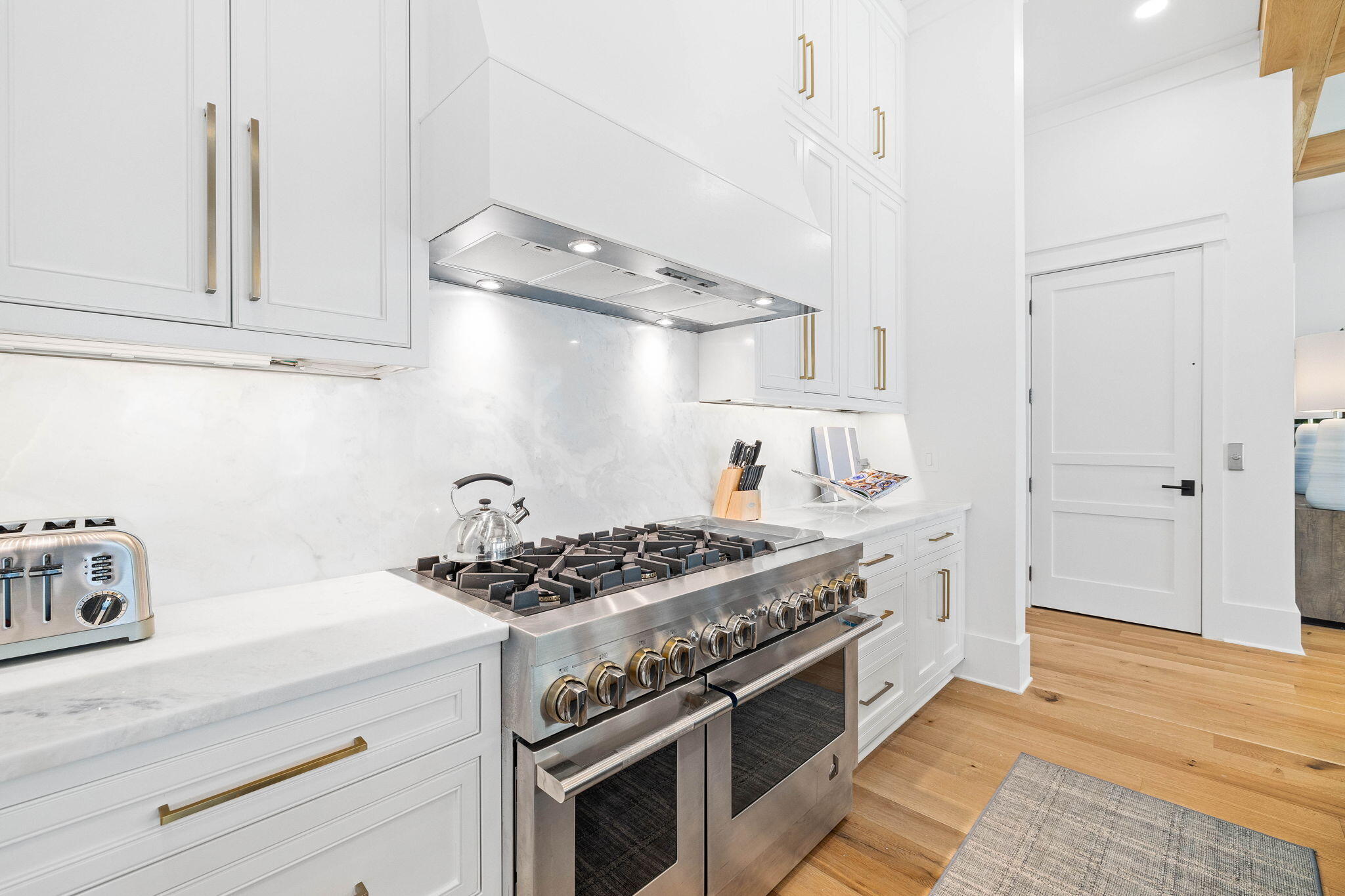 48 Paradise By The Sea Boulevard Inlet Beach, FL 32461 - Photo 28 of 97 a kitchen with stainless steel appliances granite countertop a stove and a sink