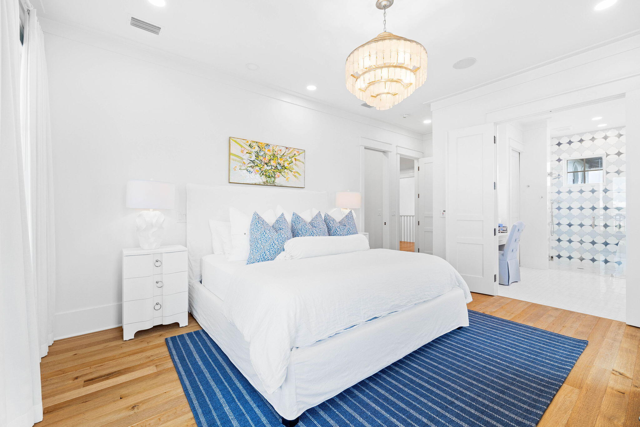 48 Paradise By The Sea Boulevard Inlet Beach, FL 32461 - Photo 61 of 97 a bedroom with a large bed and a chandelier