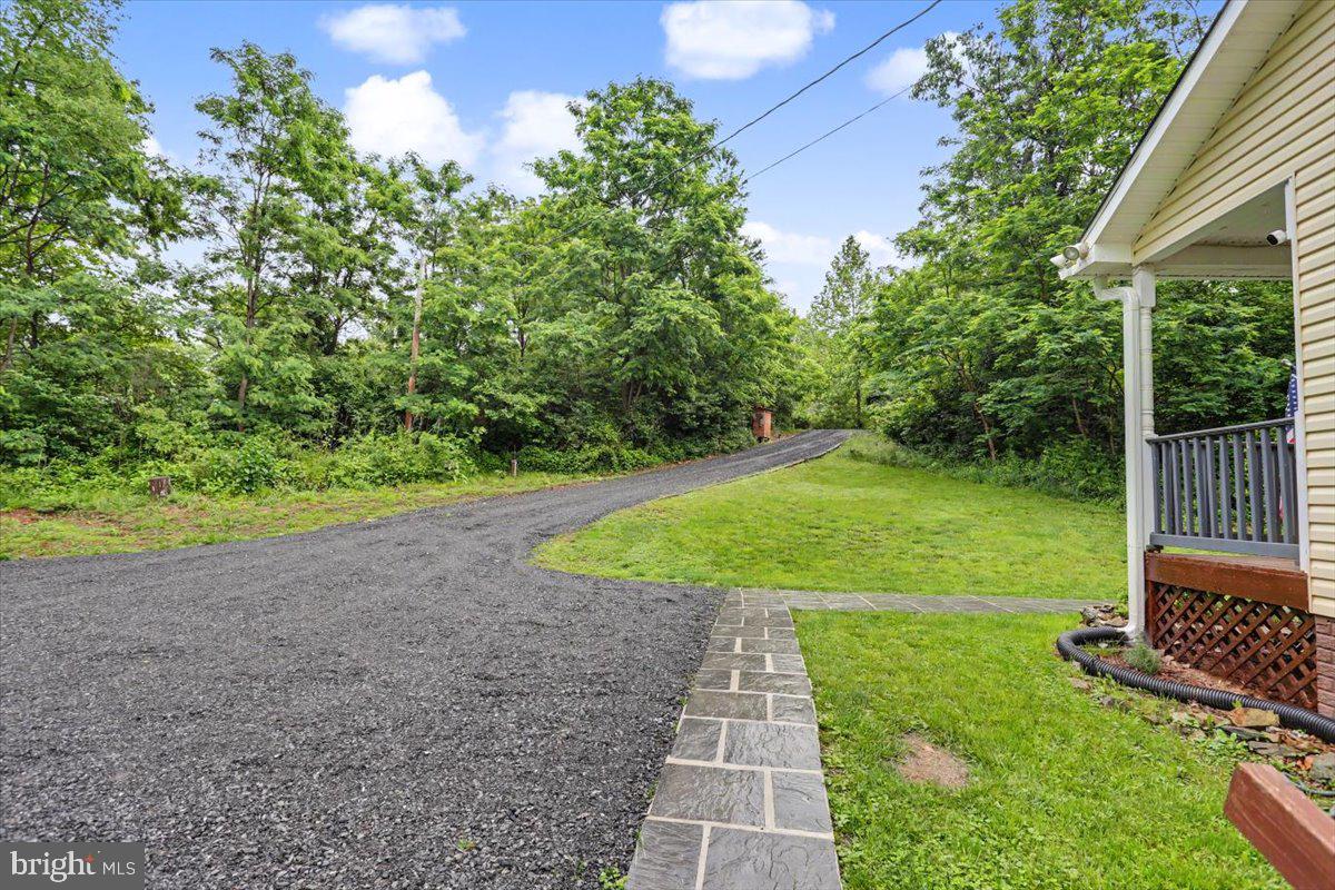 543 Whiskey Still Road Linden, VA 22642 - Photo 4 of 23 a view of a backyard with garden