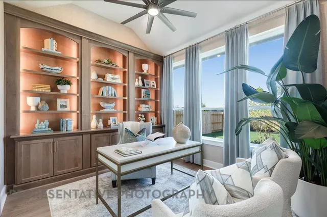 a living room with furniture a rug and a chandelier