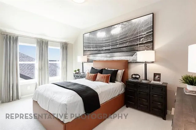 a bed room with a bed and a window