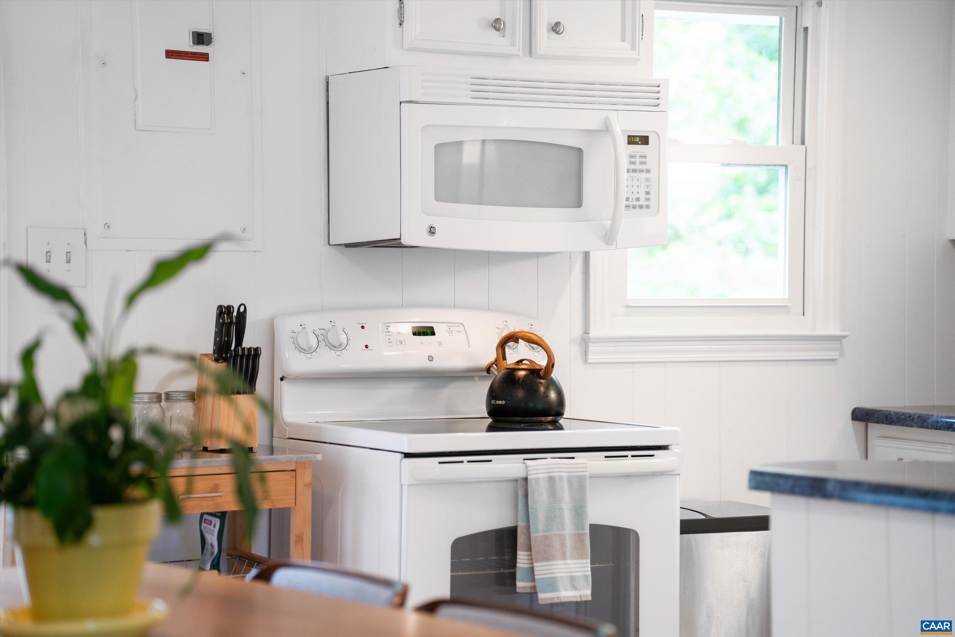 2833 Milton Road Charlottesville, VA 22902 - Photo 12 of 44 a kitchen with a stove and white cabinets