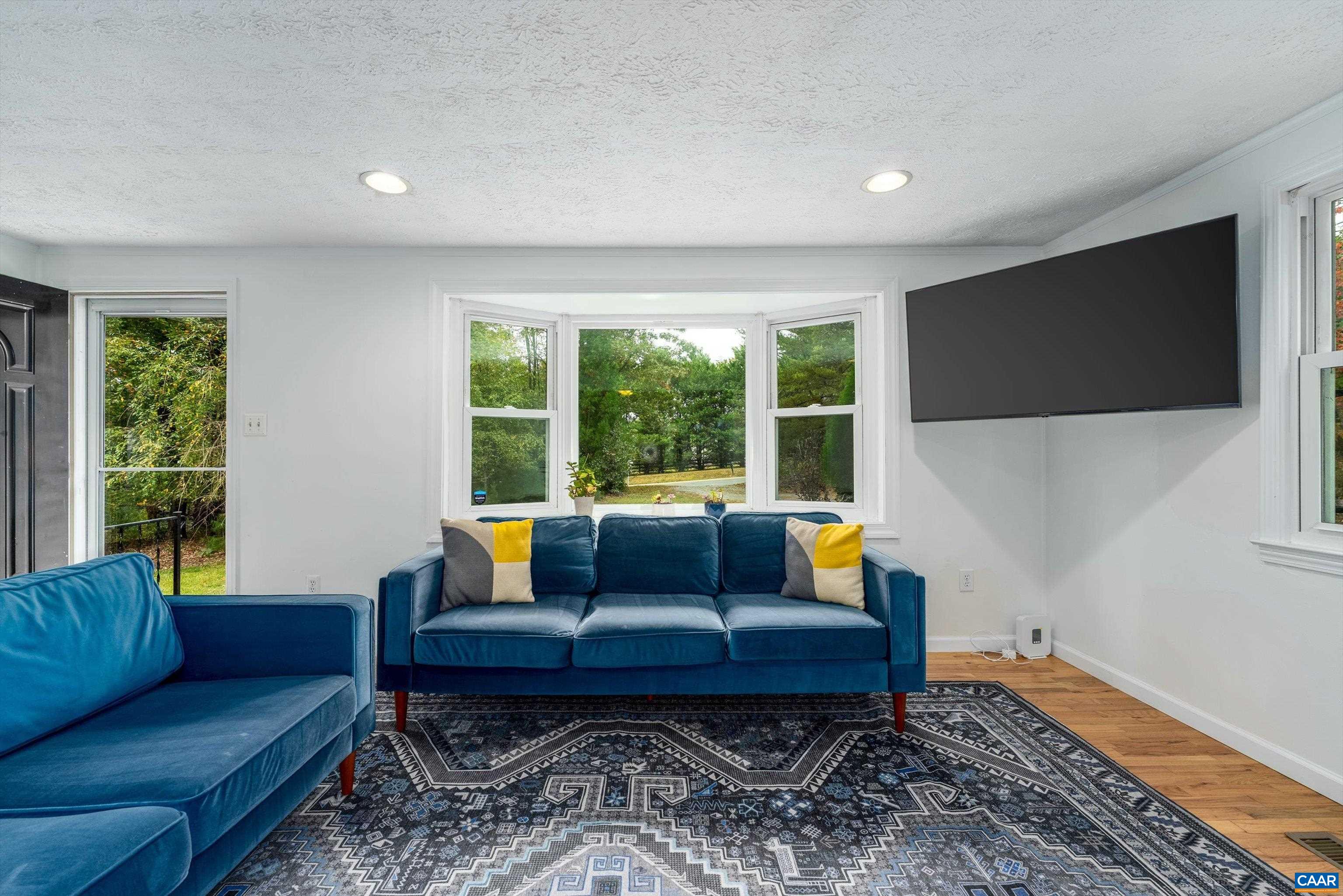 2833 Milton Road Charlottesville, VA 22902 - Photo 15 of 44 a living room with furniture and a flat screen tv