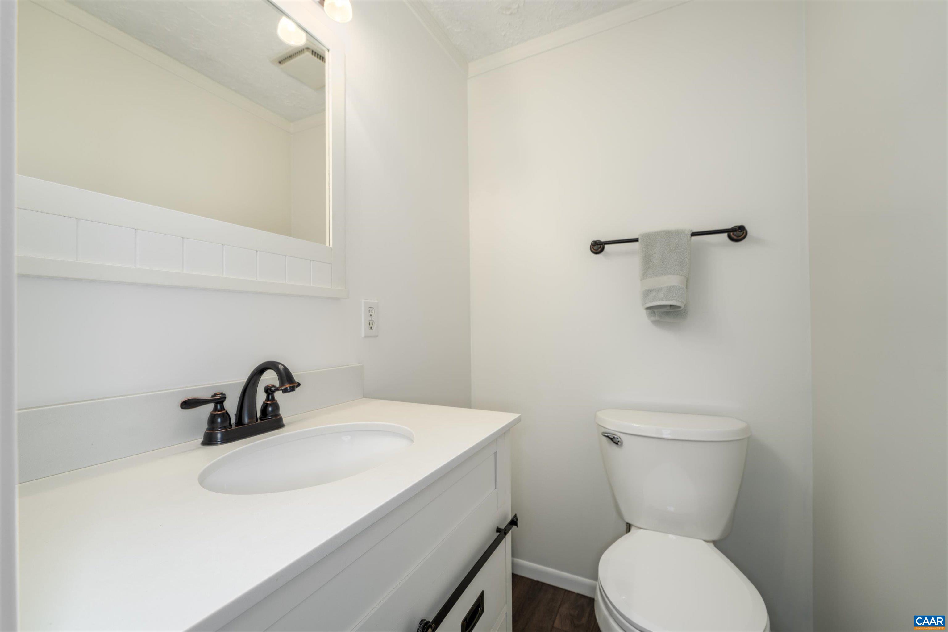 2833 Milton Road Charlottesville, VA 22902 - Photo 23 of 44 a bathroom with a sink toilet and a mirror