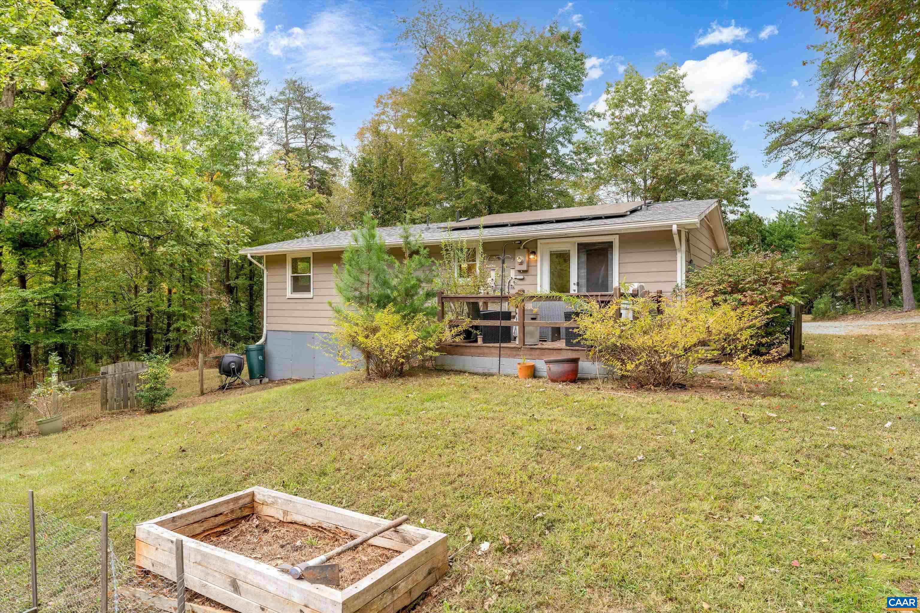 2833 Milton Road Charlottesville, VA 22902 - Photo 31 of 44 a view of a house with backyard porch and sitting area