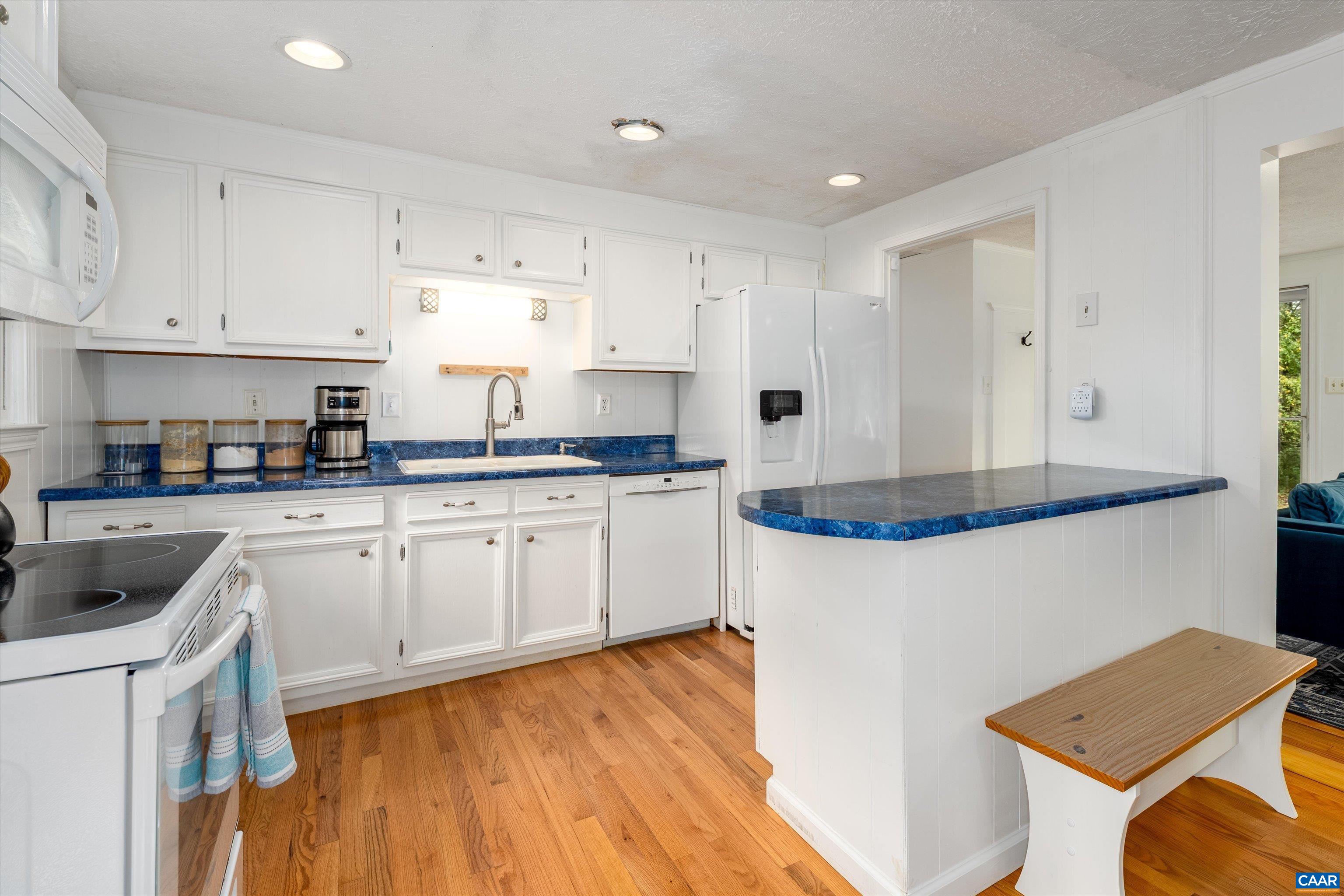 2833 Milton Road Charlottesville, VA 22902 - Photo 9 of 44 a kitchen with granite countertop white cabinets and white appliances