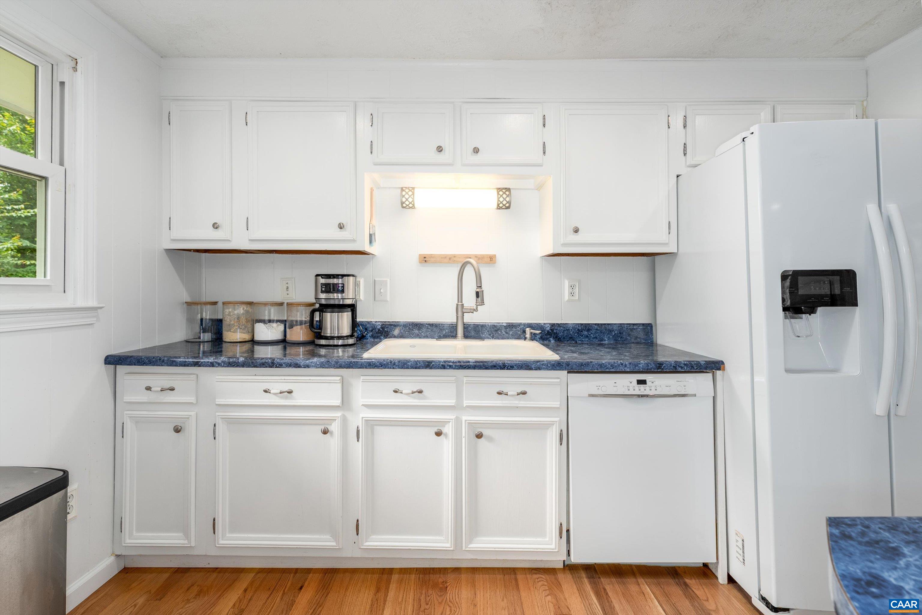 2833 Milton Road Charlottesville, VA 22902 - Photo 10 of 44 a kitchen with granite countertop a sink cabinets and stainless steel appliances