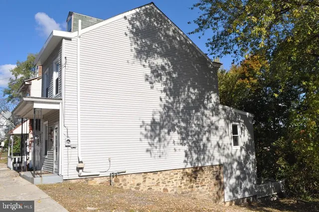 a view of a house with a tree