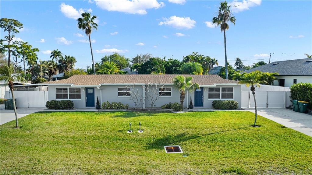 732 108th Avenue North Naples, FL 34108 - Photo 16 of 28 a backyard of a house with yard table and chairs