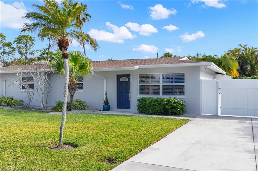 732 108th Avenue North Naples, FL 34108 - Photo 17 of 28 a house view with a garden space