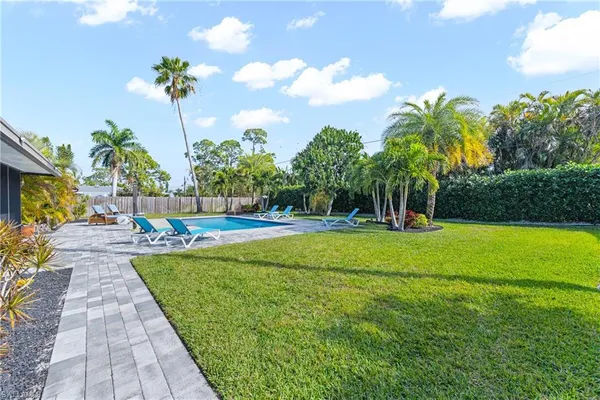 a view of a swimming pool with a garden