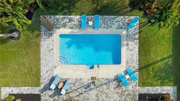 swimming pool view with a outdoor seating space