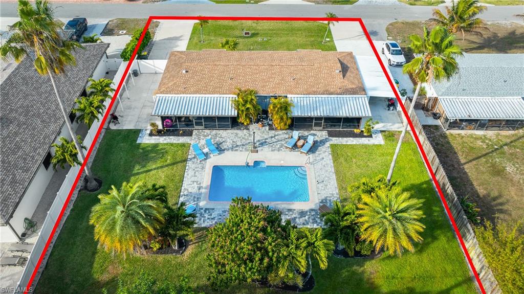 732 108th Avenue North Naples, FL 34108 - Photo 27 of 28 a view of swimming pool with a table and chairs