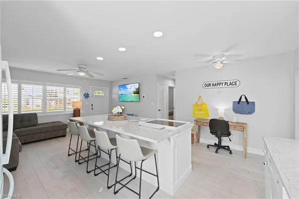 a view of a dining room with furniture and a large window