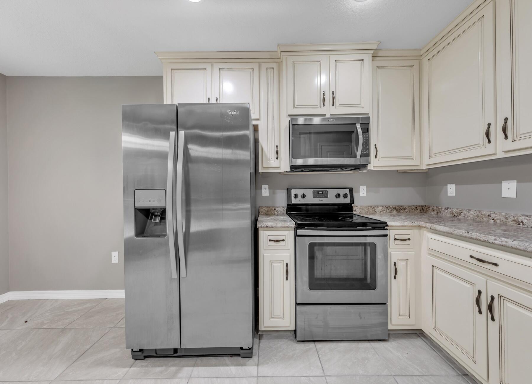 129 Fairway Drive Crestview, FL 32536 - Photo 11 of 30 a kitchen with cabinets stainless steel appliances and a counter space