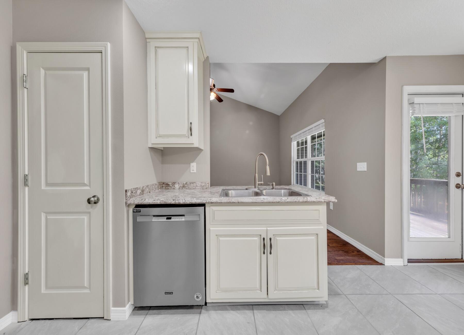 129 Fairway Drive Crestview, FL 32536 - Photo 12 of 30 a bathroom with a granite countertop sink and a mirror