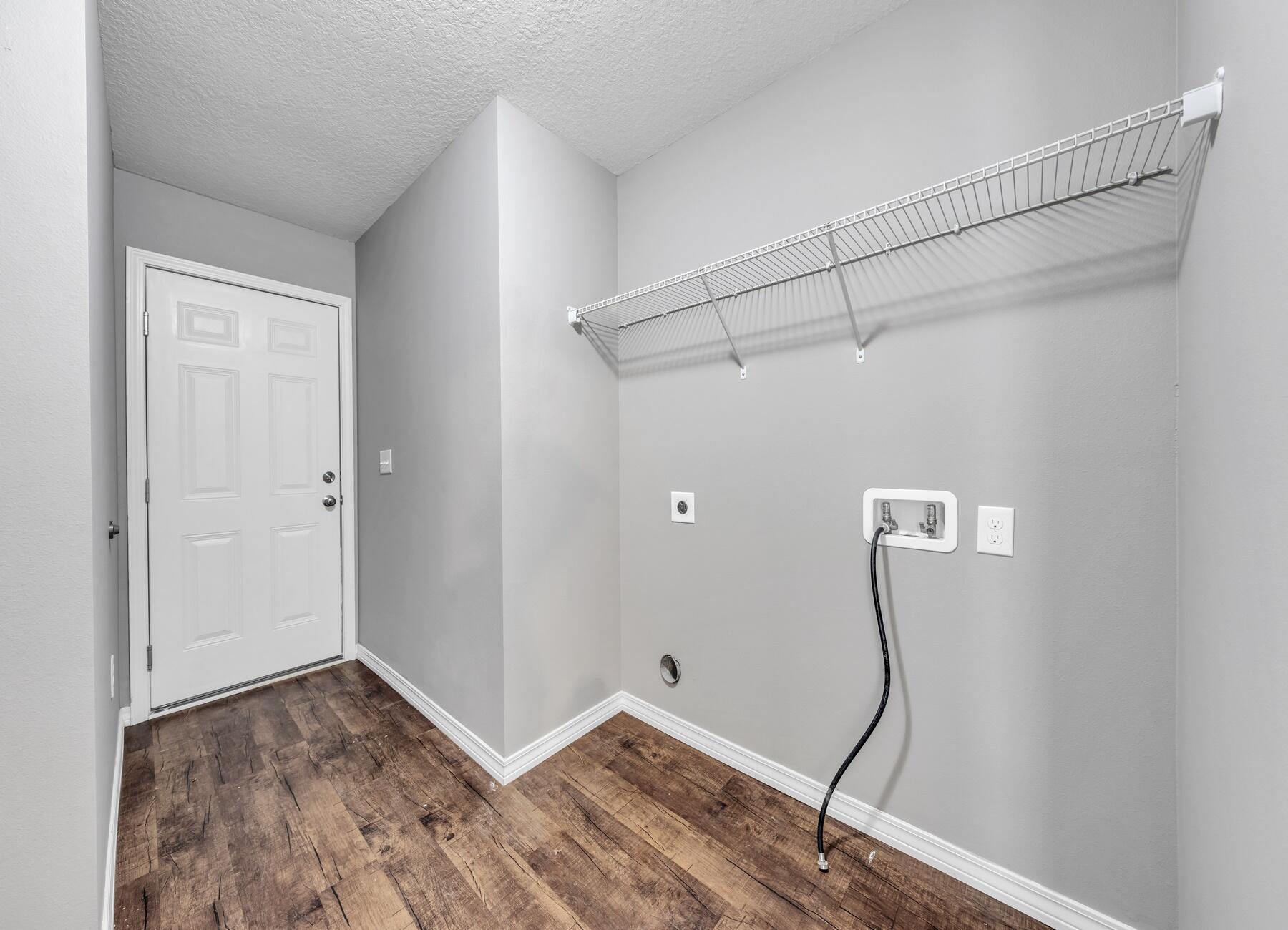 129 Fairway Drive Crestview, FL 32536 - Photo 20 of 30 a view of a room with wooden floor and white walls