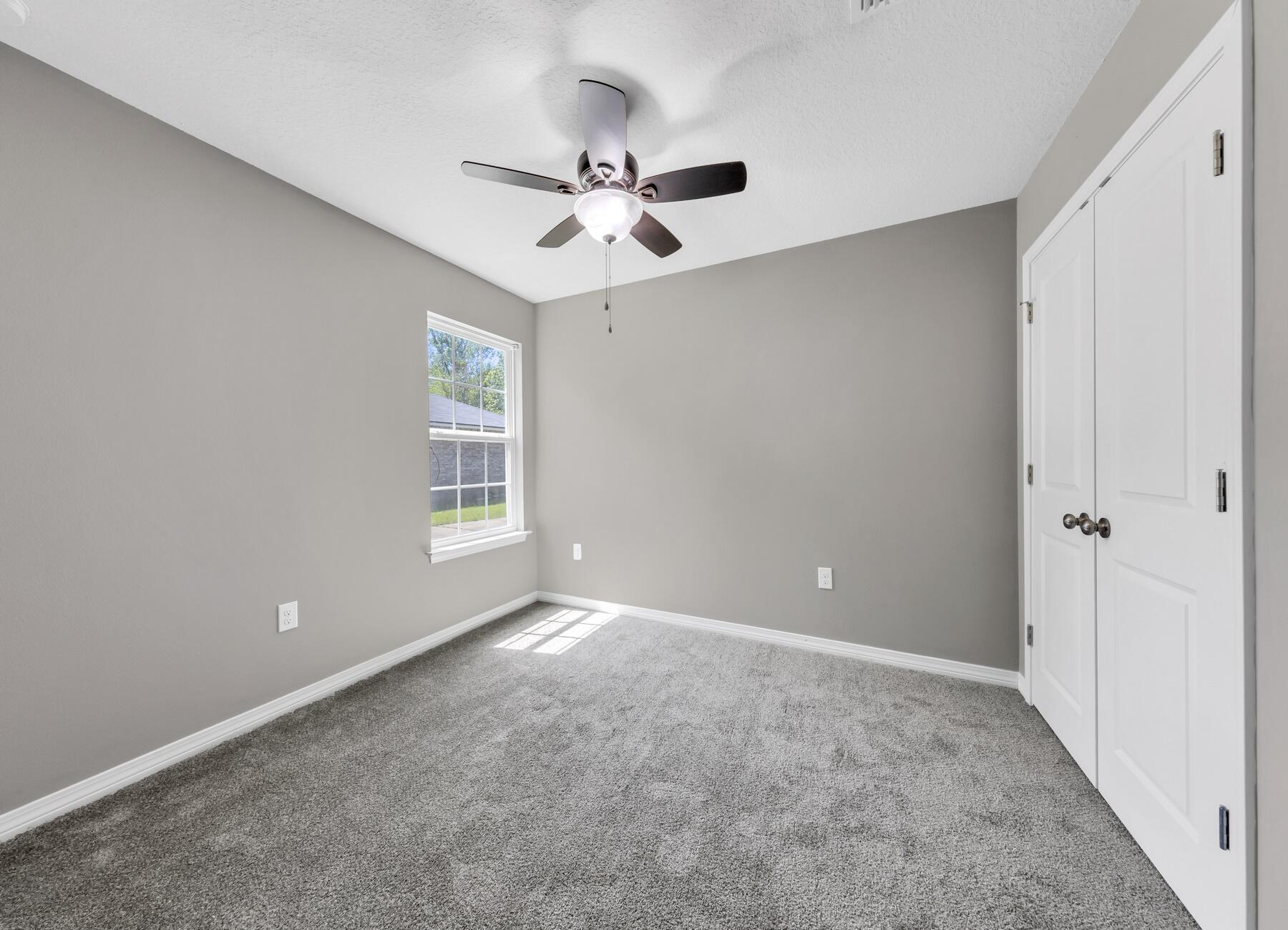 129 Fairway Drive Crestview, FL 32536 - Photo 21 of 30 a view of an empty room with a window