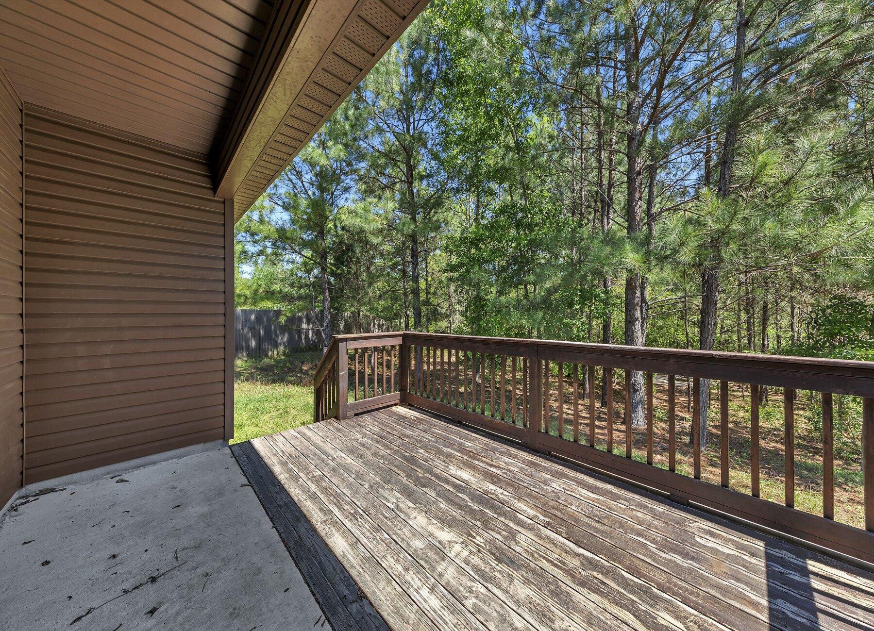 129 Fairway Drive Crestview, FL 32536 - Photo 26 of 30 a balcony with wooden floor and fence