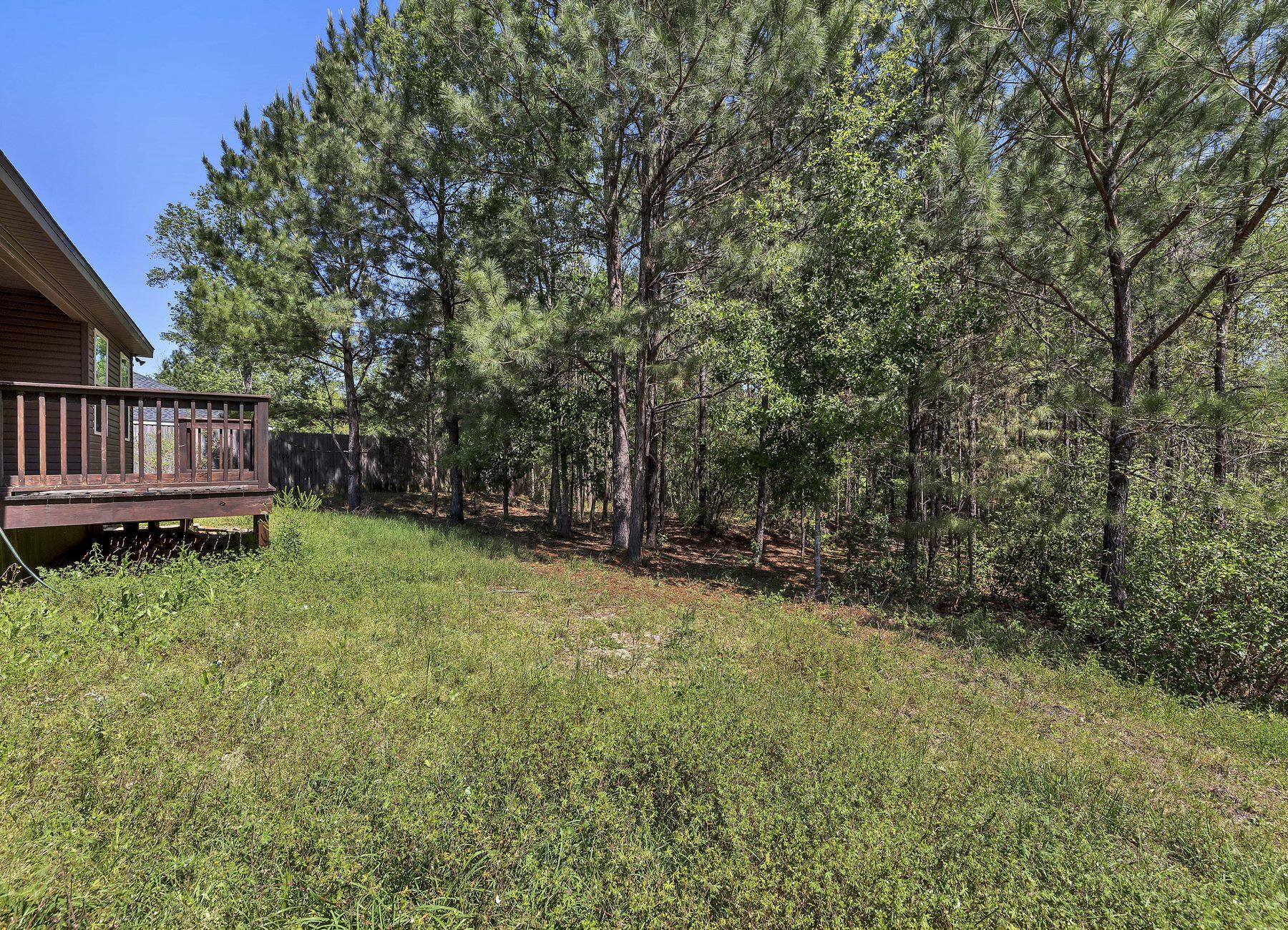 129 Fairway Drive Crestview, FL 32536 - Photo 28 of 30 a view of backyard with small cabin