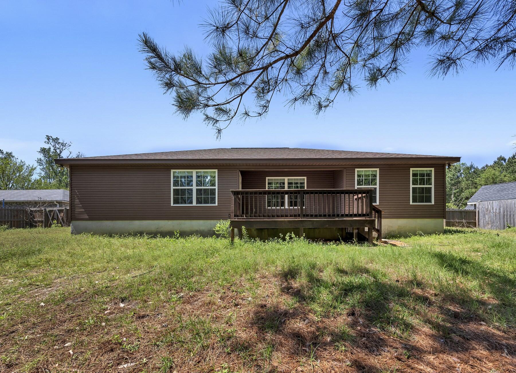 129 Fairway Drive Crestview, FL 32536 - Photo 30 of 30 a house view with a garden space