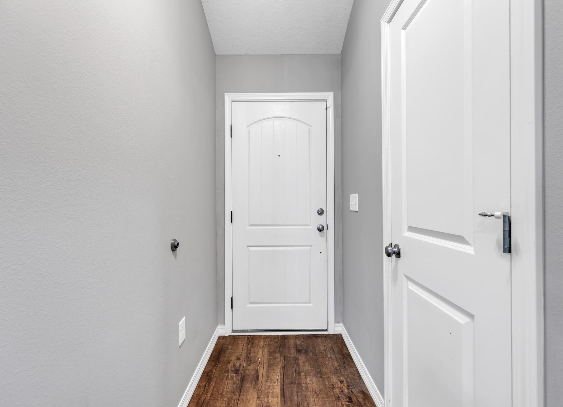 129 Fairway Drive Crestview, FL 32536 - Photo 3 of 30 a view of a hallway with wooden floor