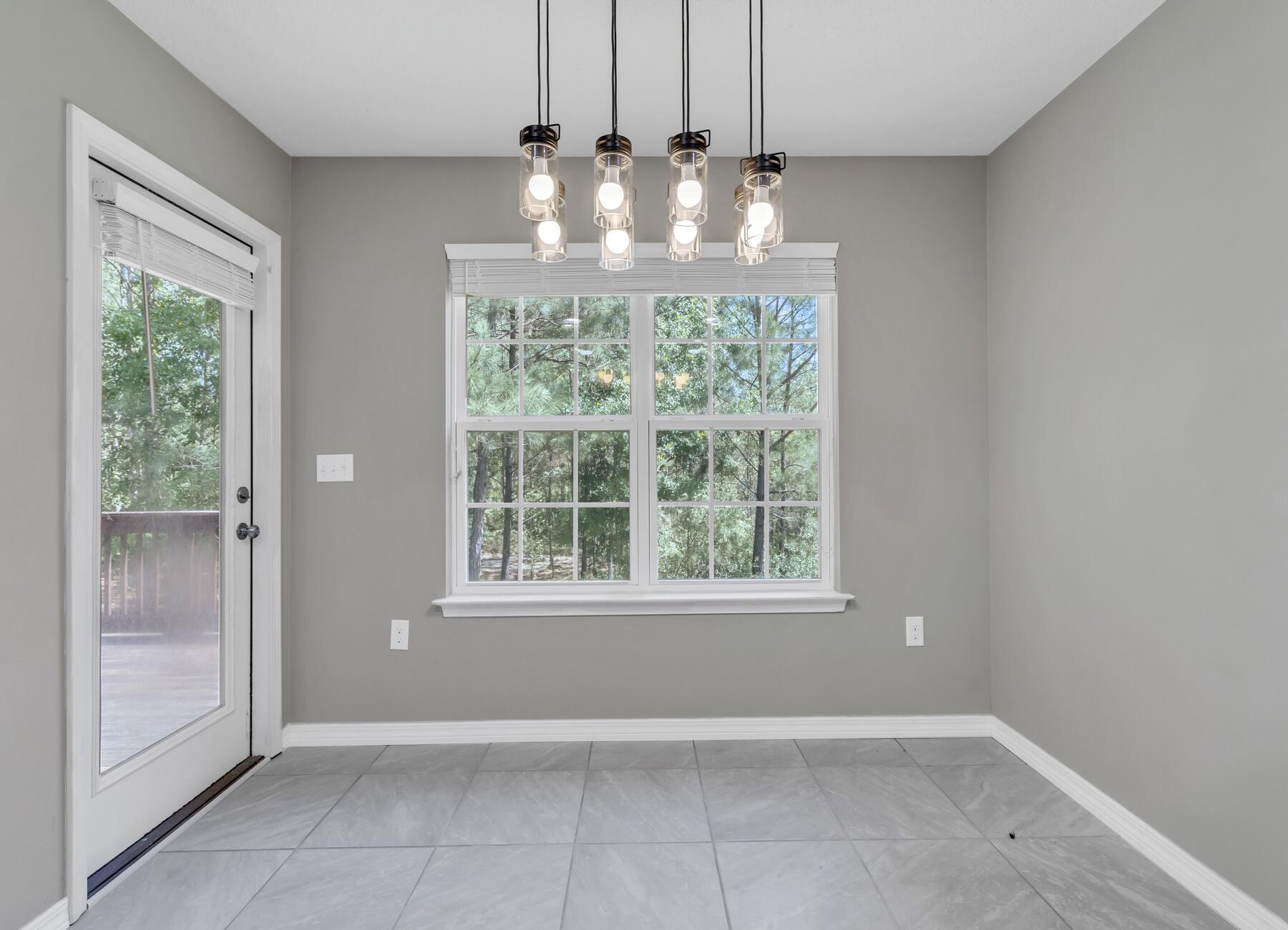 129 Fairway Drive Crestview, FL 32536 - Photo 7 of 30 a view of an empty room with a window