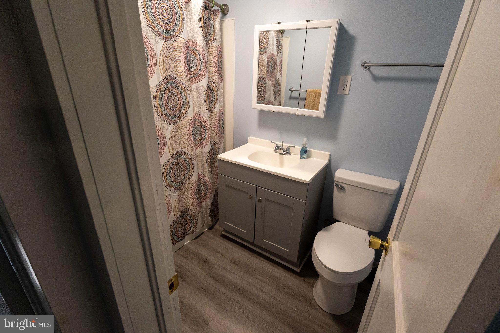 439 Peckatone Road Kinsale, VA 22488 - Photo 11 of 15 a bathroom with a toilet sink and vanity