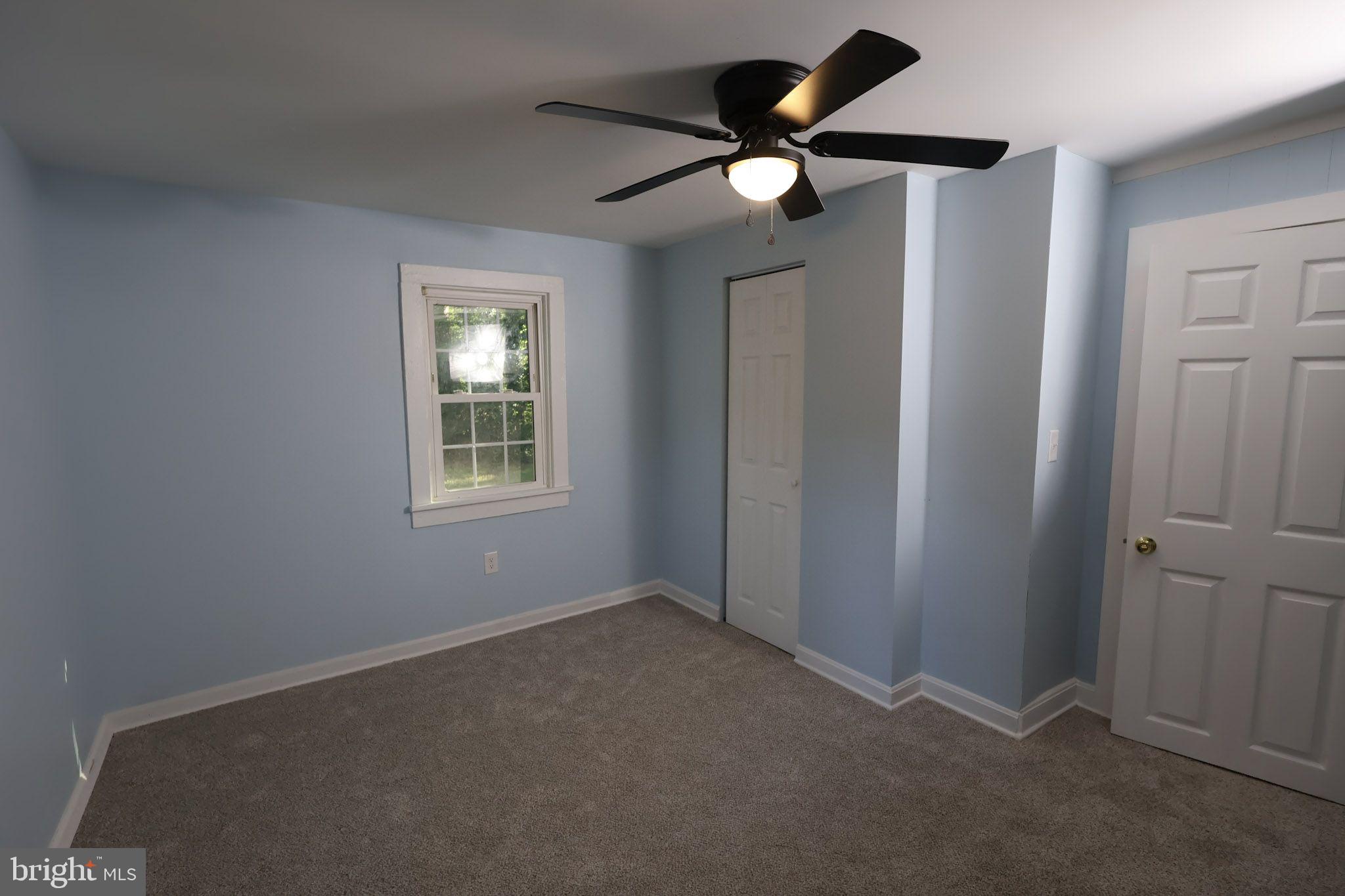 439 Peckatone Road Kinsale, VA 22488 - Photo 12 of 15 an empty room with windows and fan
