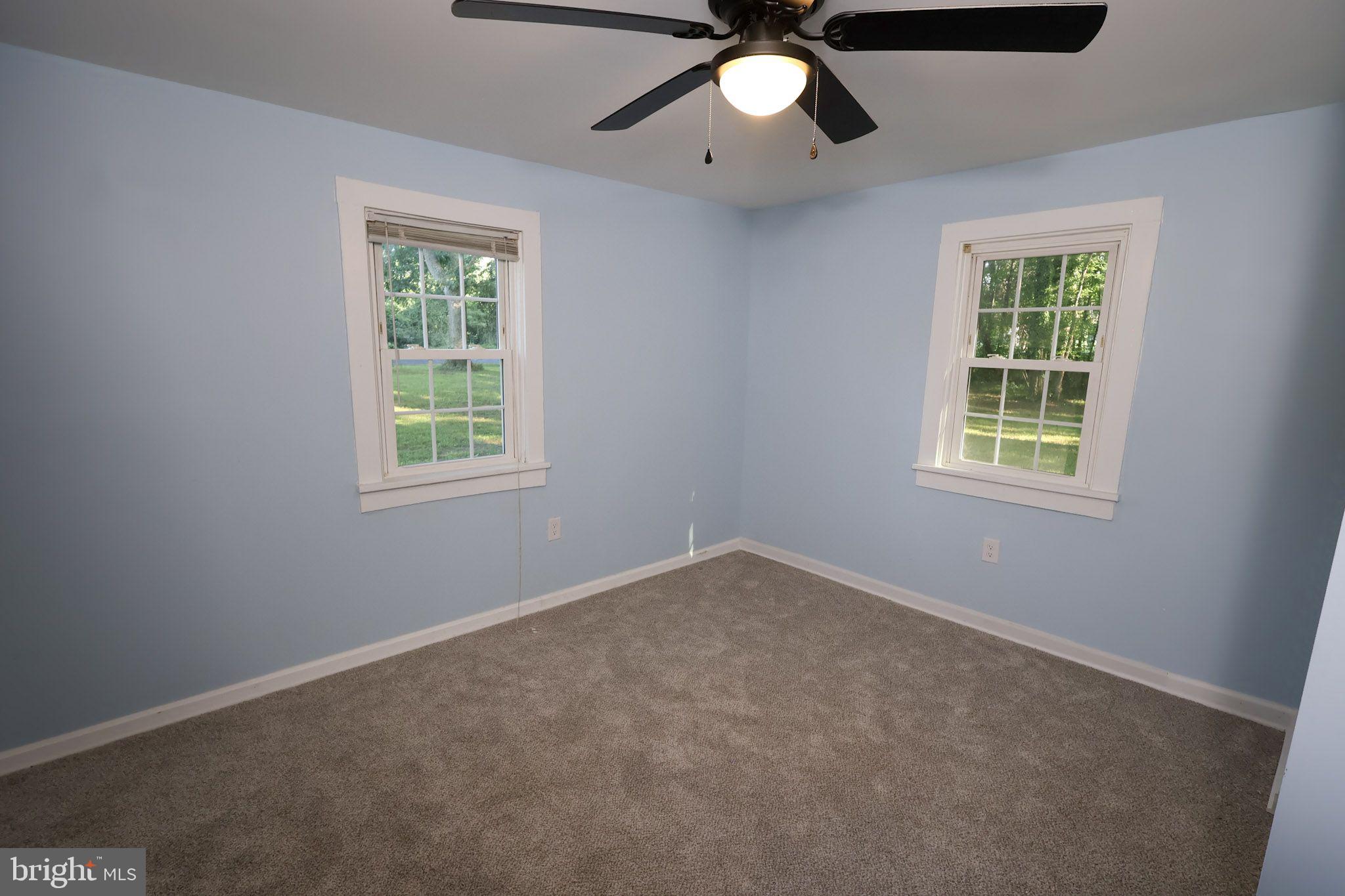 439 Peckatone Road Kinsale, VA 22488 - Photo 13 of 15 an empty room with a window and a fan