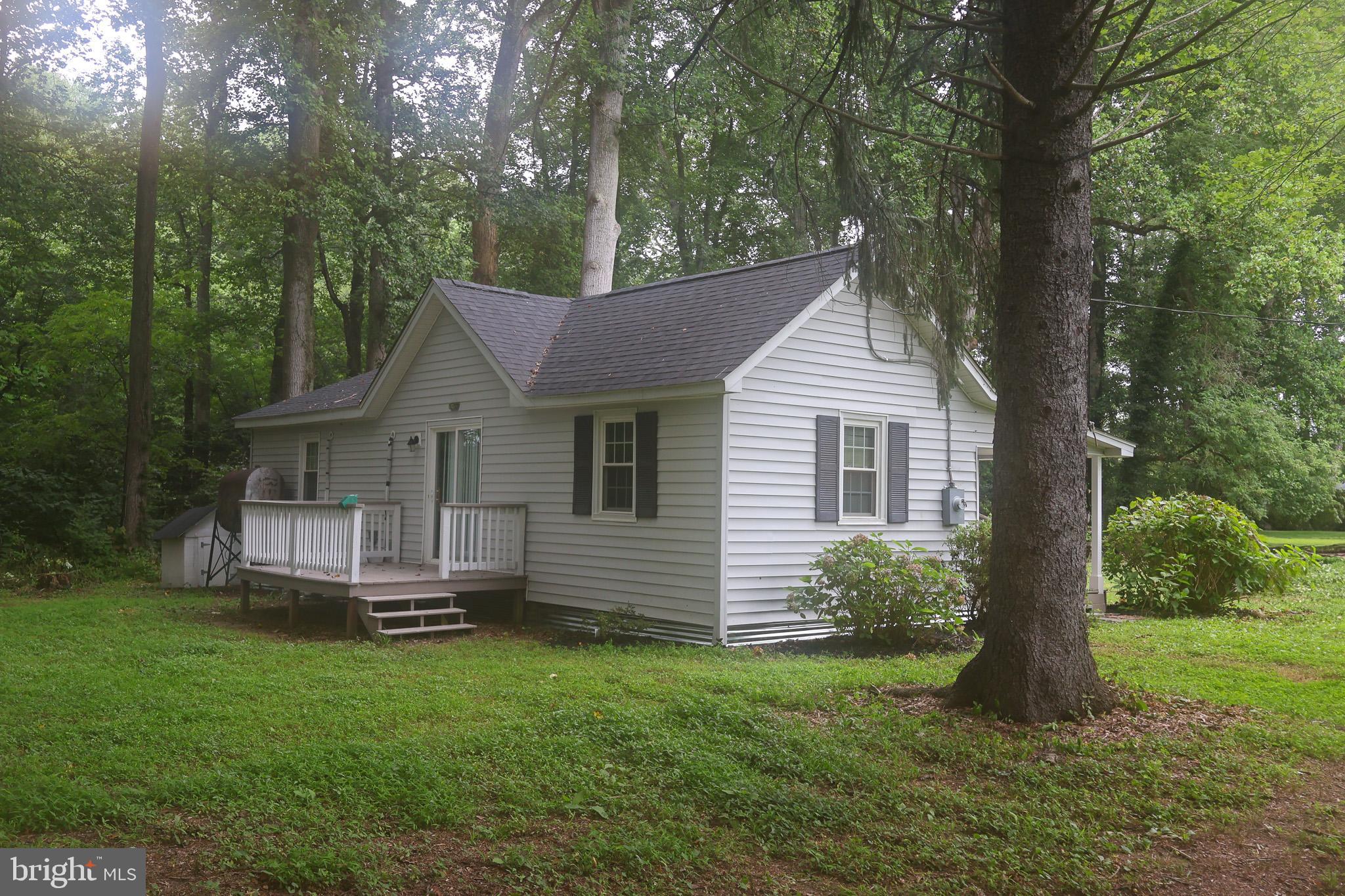 439 Peckatone Road Kinsale, VA 22488 - Photo 15 of 15 a front view of a house with a garden and yard