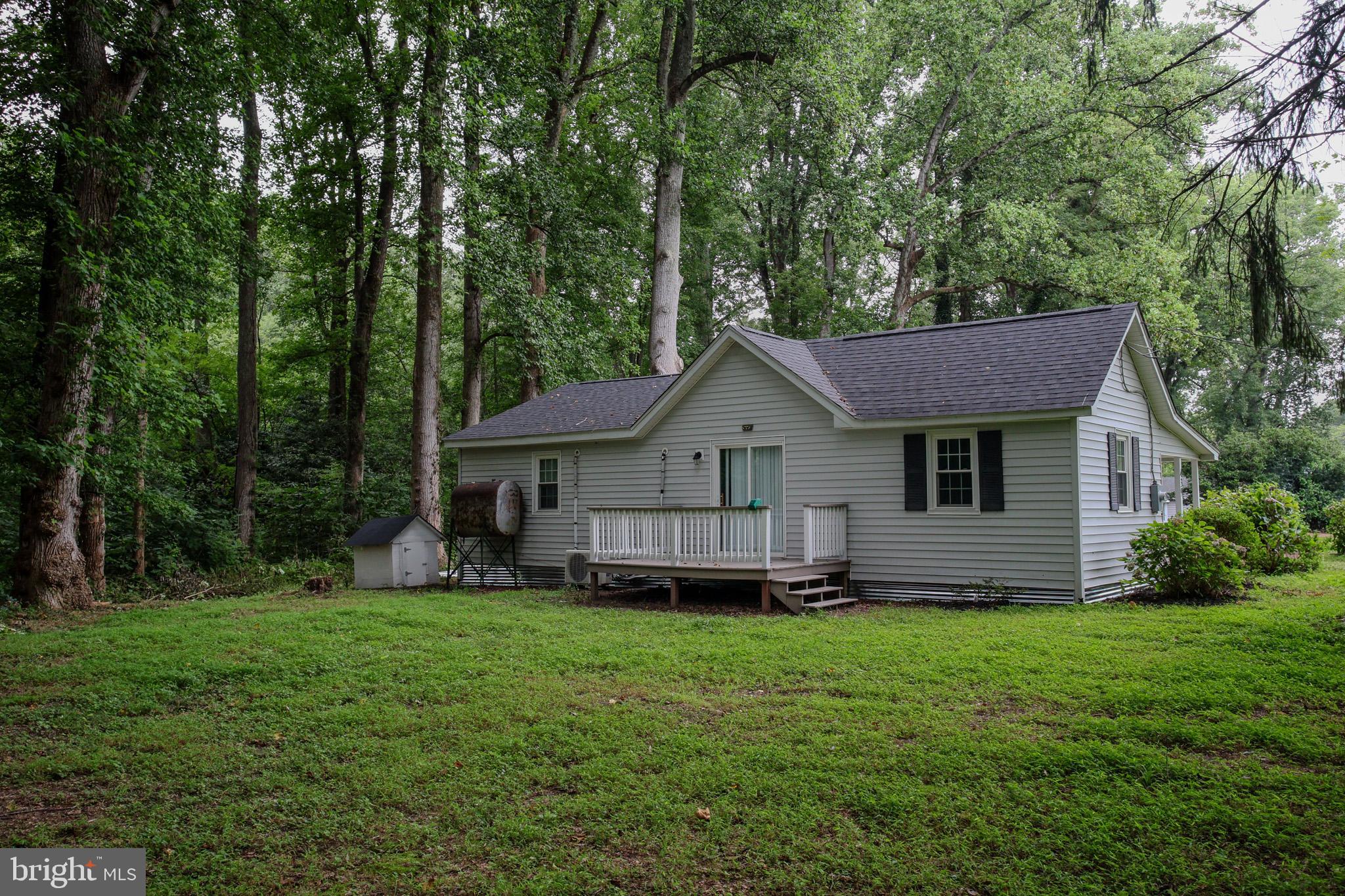 439 Peckatone Road Kinsale, VA 22488 - Photo 4 of 15 a front view of a house with a yard and trees