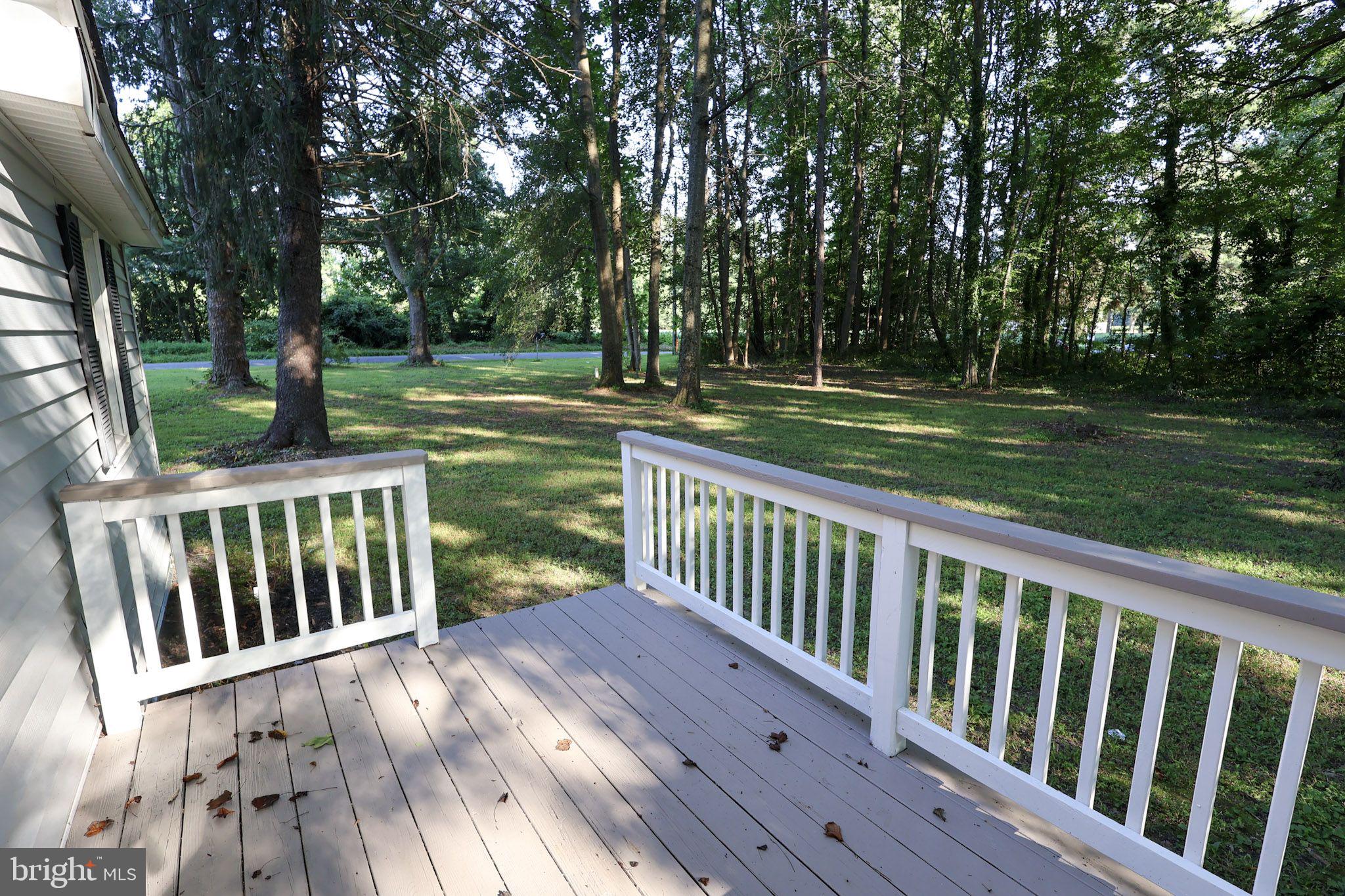 439 Peckatone Road Kinsale, VA 22488 - Photo 10 of 15 a view of backyard with two trees and wooden fence