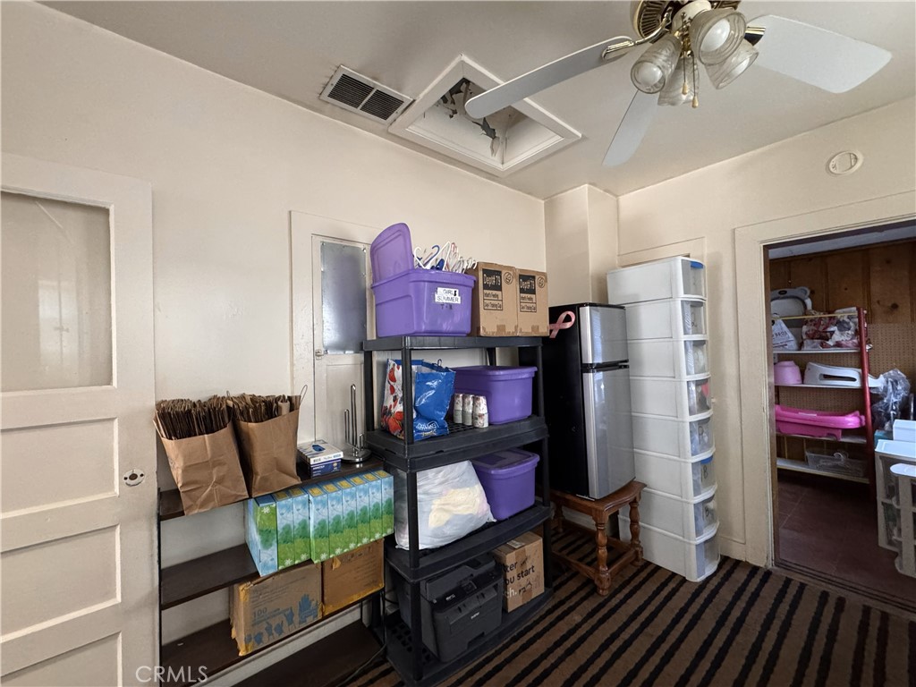 521 East Williams Street Barstow, CA 92311 - Photo 8 of 25 a view of a livingroom with furniture a flat screen tv and wooden floor