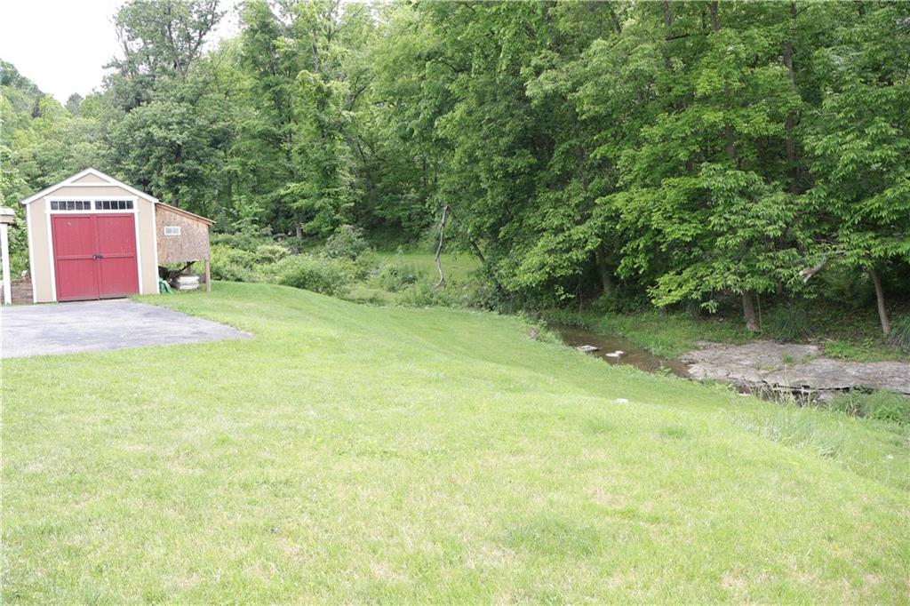551 Muse-Bishop Road McDonald, PA 15057 - Photo 32 of 38 a backyard of a house with a yard and outdoor seating