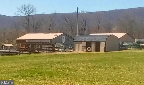 a front view of house with yard and swimming pool