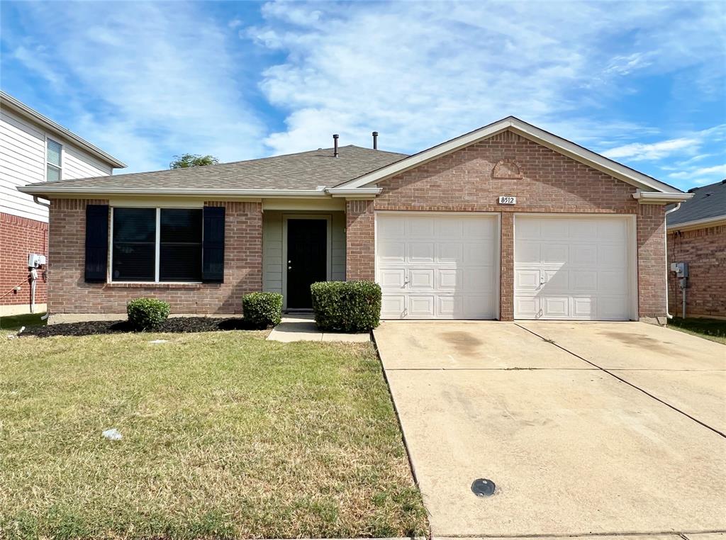 a front view of a house with yard