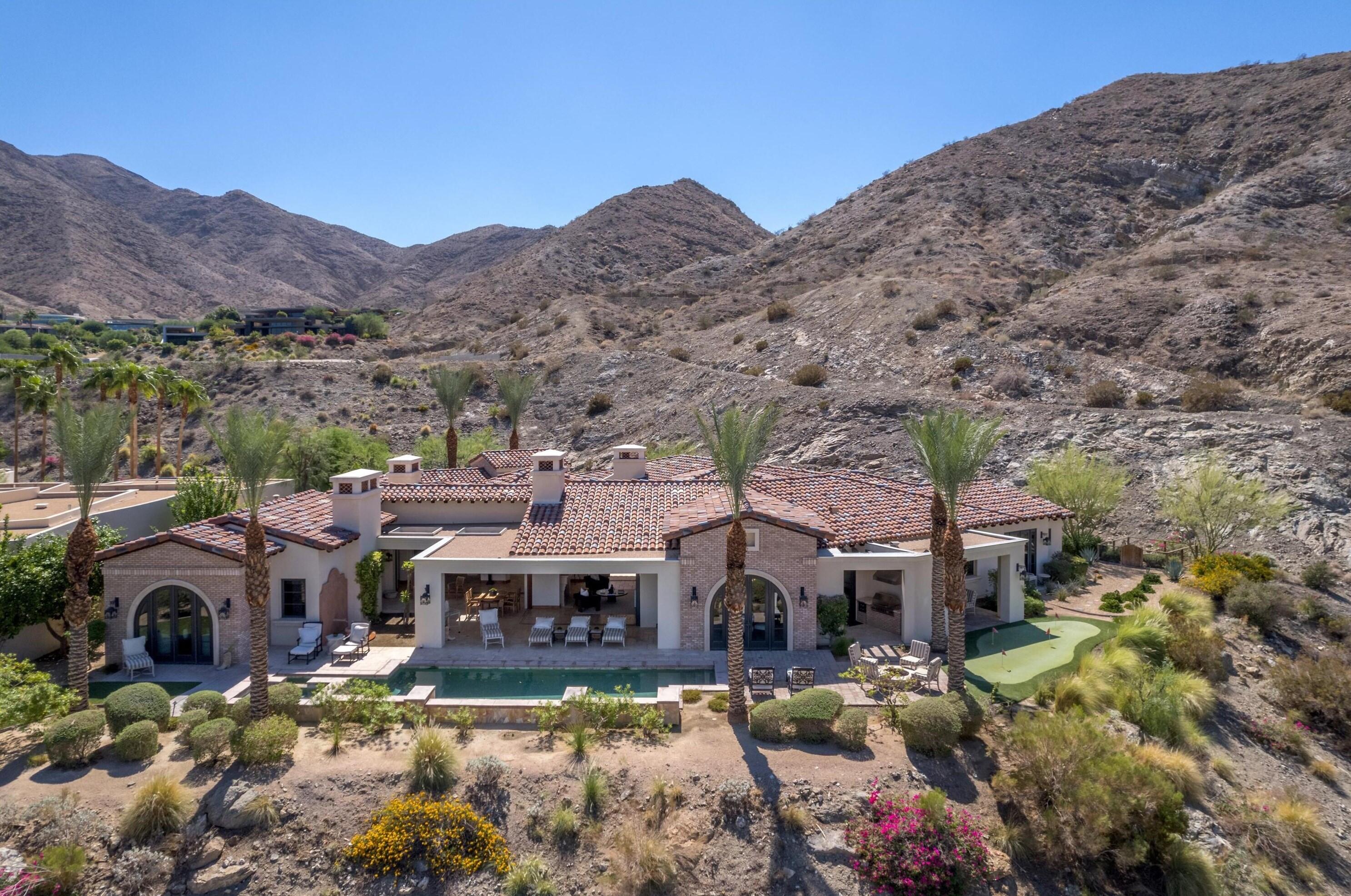 a view of a town with mountains in the background